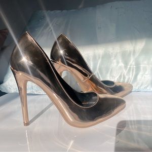Rose gold pump, light damage to outside of toe area. Never worn before.